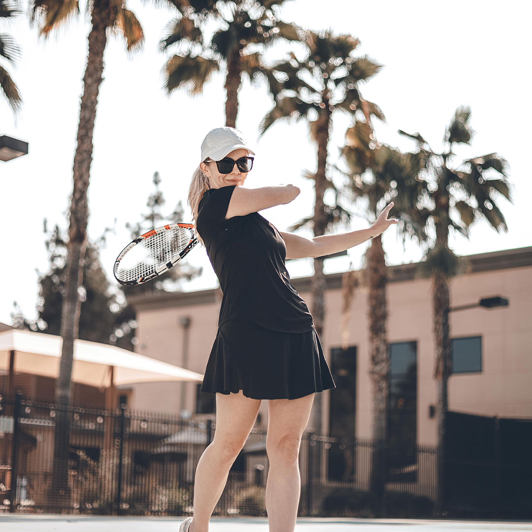 Woman playing tennis outdoors