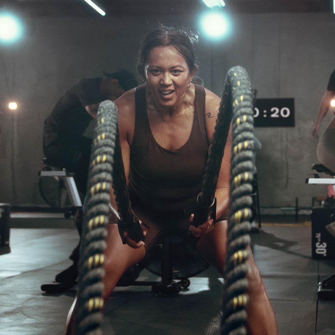 woman squatting with a barbell