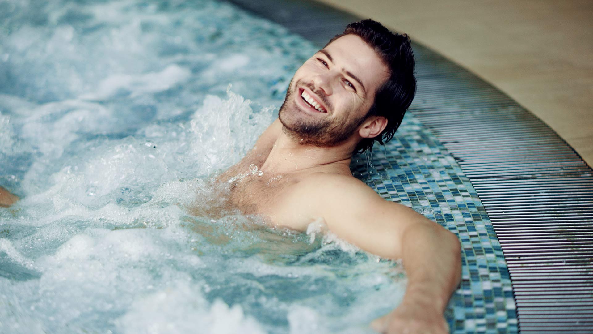 Woman relaxing in outdoor spa