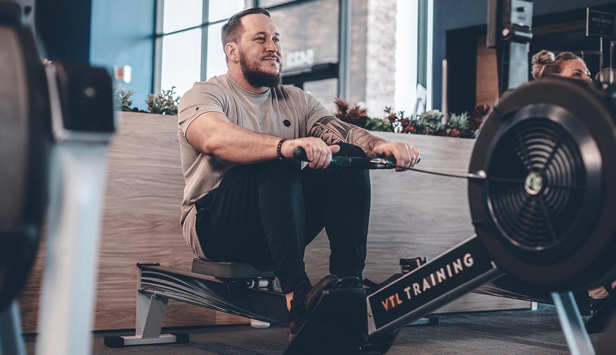 man on a rowing machine