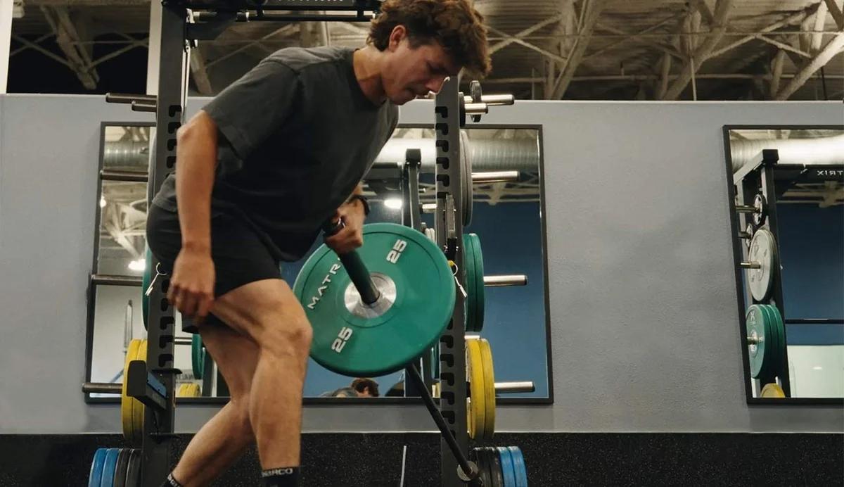 man in gym lifting weights