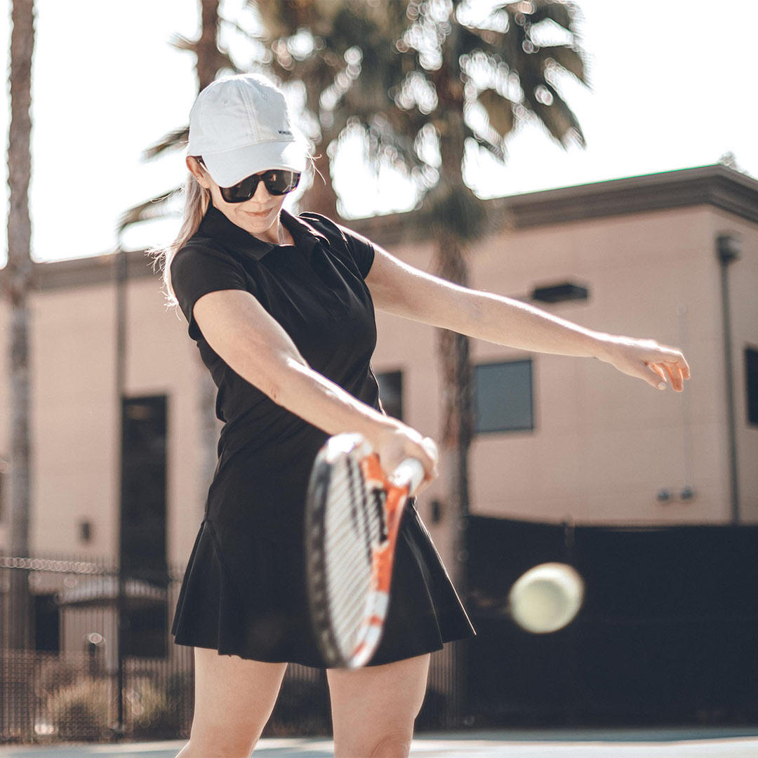 Woman playing Tennis outdoors