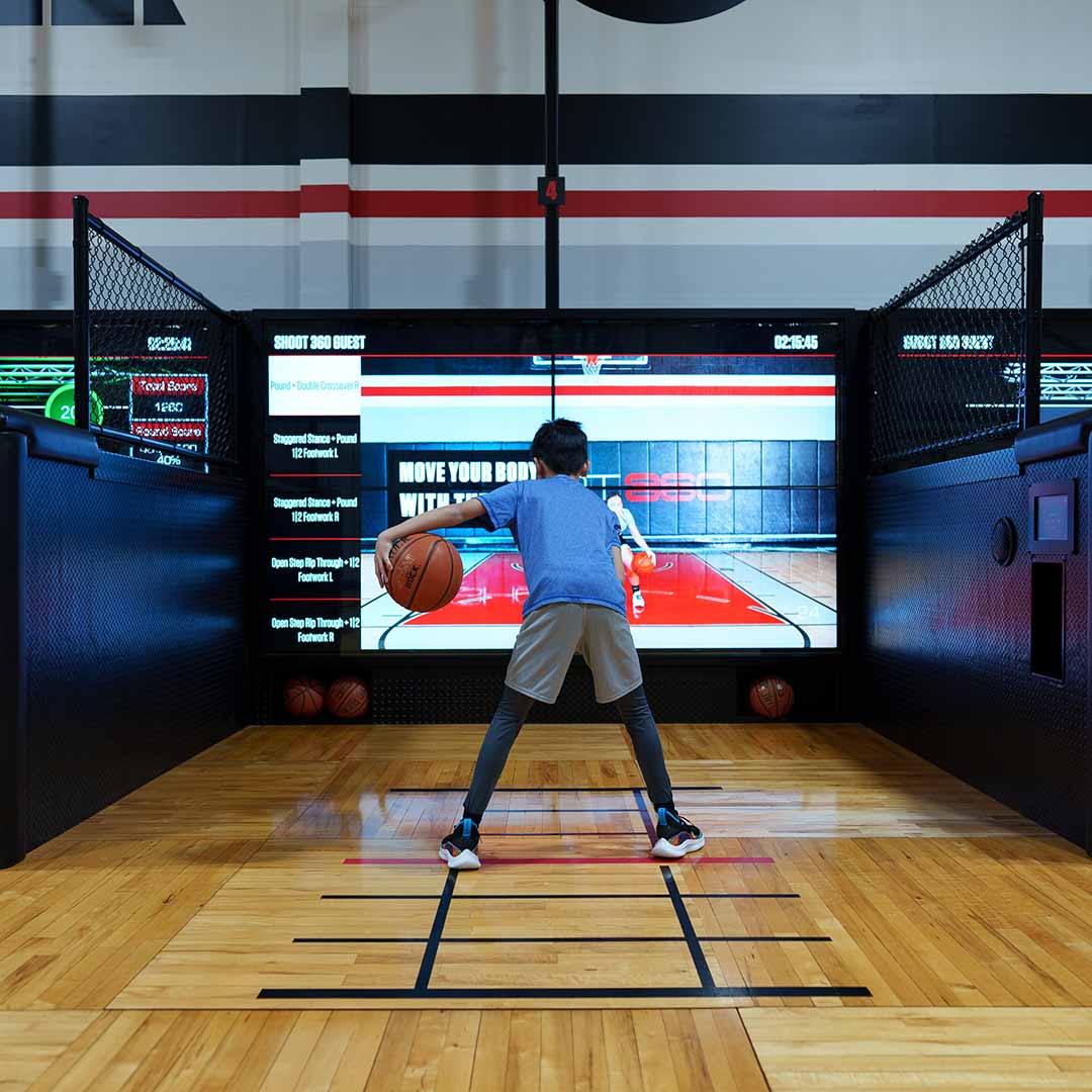 Boy using Shoot360 basketball hoop