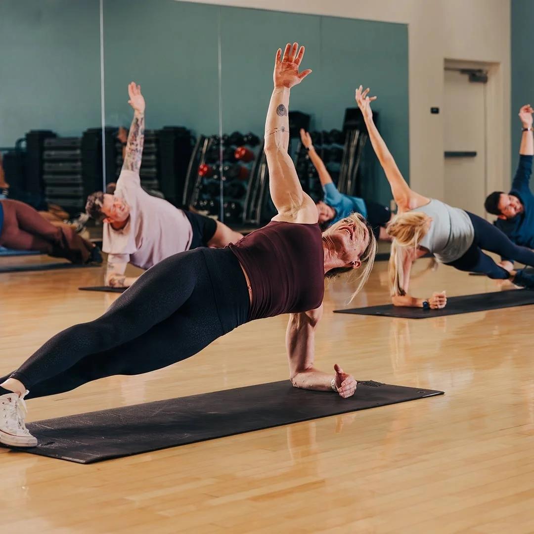 A group of people in a Pilates class