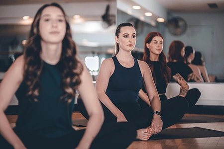 group of women in a yoga class