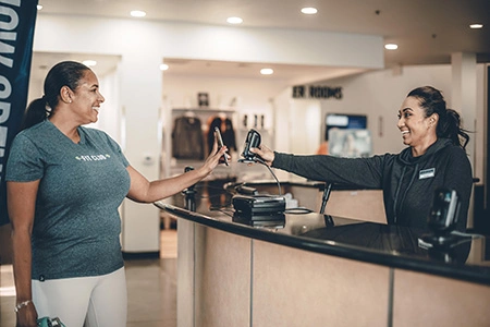 woman checking in at front desk
